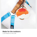 Load image into Gallery viewer, Egg tart charm clipped to a dog harness outdoors