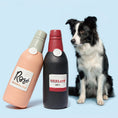 Load image into Gallery viewer, Floating Latex Wine Bottle Dog Toy – Squeaky & Interactive
